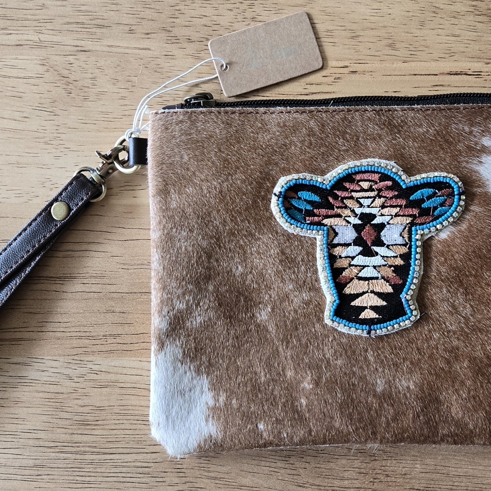 Brown and White Cowhide Wristlet with Embroidered Aztec Cow Design